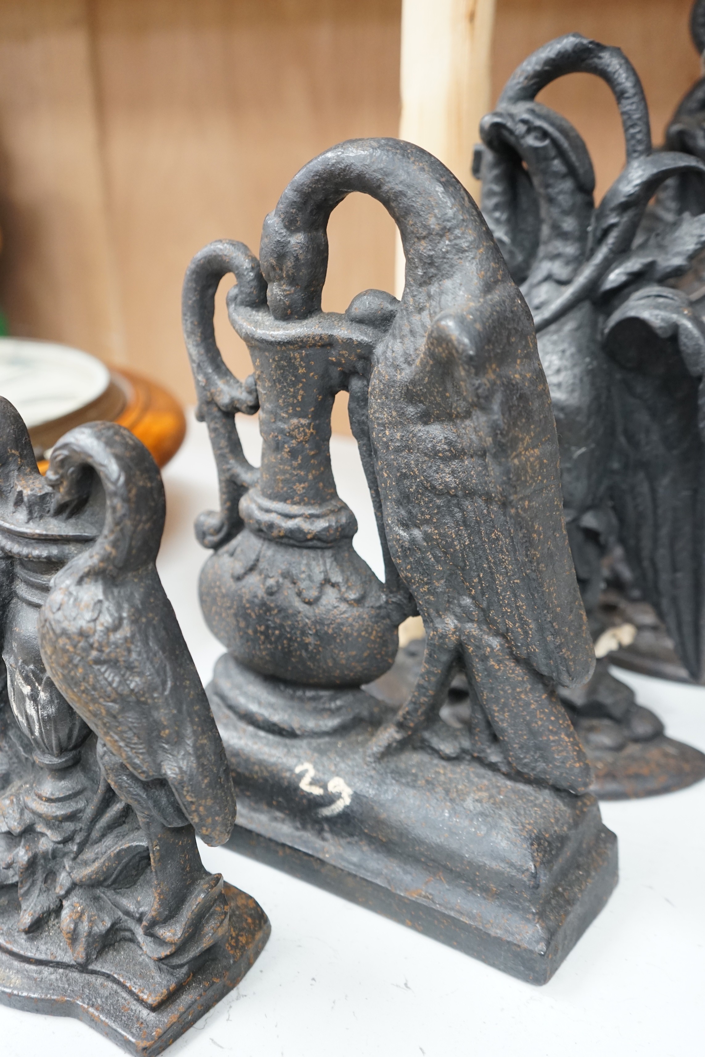 Five assorted cast iron bird designed doorstops, tallest swan 40cms high